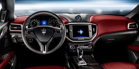 Motor vehicle, Mode of transport, Automotive design, Steering part, Steering wheel, Center console, Red, Car, Vehicle audio, Technology, 