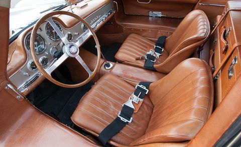 Motor vehicle, Steering part, Brown, Steering wheel, Car seat, Car, Center console, Personal luxury car, Classic car, Vehicle door, 