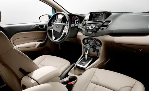 Motor vehicle, Steering part, Automotive design, Brown, Product, Steering wheel, White, Center console, Vehicle audio, Technology, 
