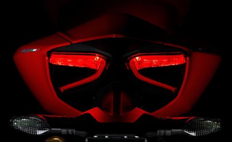Automotive design, Automotive lighting, Red, Personal protective equipment, Orange, Amber, Light, Carmine, Motorcycle accessories, Darkness, 