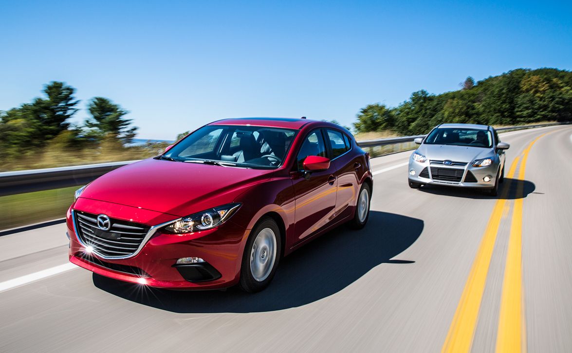 2014 mazda 3 i grand touring and 2014 ford focus se