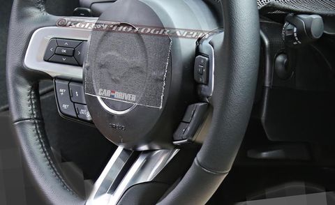 Automotive design, Steering part, Steering wheel, Luxury vehicle, Carbon, Personal luxury car, Center console, Gear shift, Leather, Silver, 