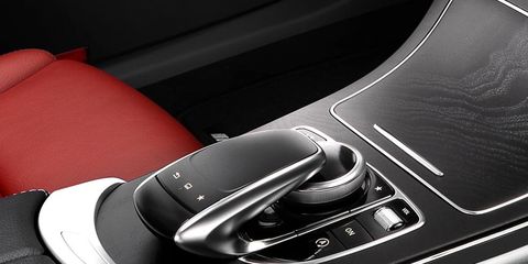 Automotive design, Car, Luxury vehicle, Personal luxury car, Gear shift, Center console, Car seat, Steering part, Gloss, Carbon, 