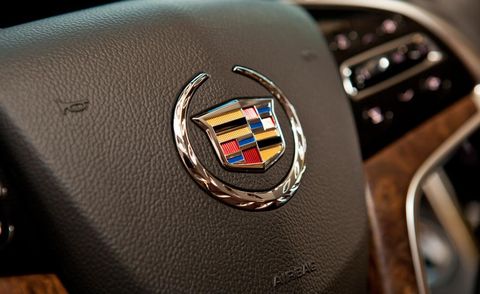 Logo, Symbol, Steering wheel, Emblem, Luxury vehicle, Brand, Steering part, Trademark, 