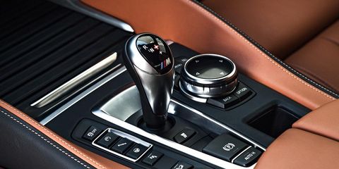 Automotive design, Center console, Personal luxury car, Luxury vehicle, Gear shift, Steering part, Steering wheel, Sports car, Kit car, 