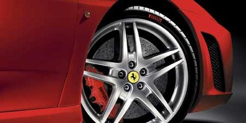 Wheel, Automotive design, Alloy wheel, Automotive exterior, Automotive wheel system, Automotive tire, Rim, Spoke, Red, Fender, 