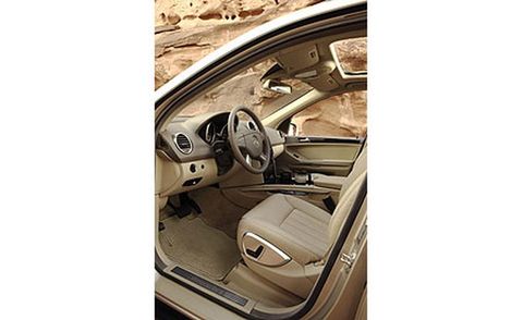 Motor vehicle, Steering part, Steering wheel, Vehicle door, Automotive mirror, Personal luxury car, Luxury vehicle, Beige, Car seat, Automotive side-view mirror, 