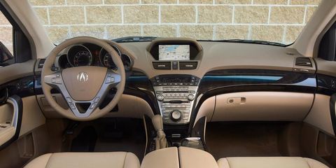 Motor vehicle, Mode of transport, Brown, Steering part, Steering wheel, White, Center console, Luxury vehicle, Car seat, Personal luxury car, 