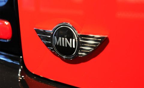 Motor vehicle, Red, Automotive exterior, Logo, Light, Symbol, Emblem, Carmine, Close-up, Trademark, 
