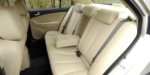 Motor vehicle, Vehicle, Car seat, Vehicle door, Car seat cover, Head restraint, Fixture, Seat belt, Family car, Luxury vehicle, 