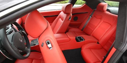 Motor vehicle, Mode of transport, Steering part, Red, Car seat, Steering wheel, Car seat cover, Vehicle door, Carmine, Luxury vehicle, 