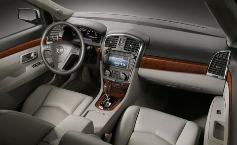 Motor vehicle, Steering part, Product, Brown, Automotive design, Steering wheel, Center console, Vehicle audio, White, Car, 