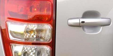 Automotive tail & brake light, Automotive lighting, Automotive exterior, Automotive parking light, Red, White, Headlamp, Light, Fixture, Logo, 