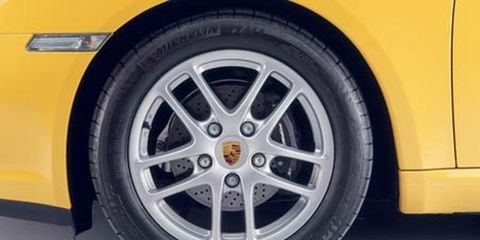 Tire, Wheel, Automotive tire, Automotive wheel system, Yellow, Alloy wheel, Automotive design, Vehicle, Rim, Automotive exterior, 