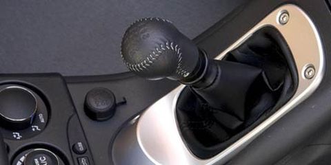 Steering part, Light, Steering wheel, Grey, Vehicle door, Game controller, Input device, Gadget, Gear shift, Machine, 