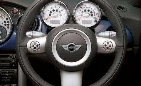 Motor vehicle, Mode of transport, Steering wheel, Steering part, Automotive design, White, Car, Speedometer, Gauge, Black, 