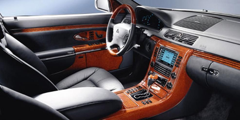 Motor vehicle, Steering part, Brown, Steering wheel, Center console, Vehicle audio, Car seat, Car, Vehicle door, Radio, 