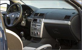 Motor vehicle, Mode of transport, Steering part, Brown, Automotive mirror, Radio, Vehicle audio, Steering wheel, Center console, Photograph, 