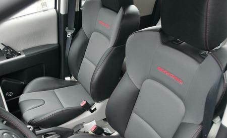 Motor vehicle, Mode of transport, Car seat, White, Head restraint, Car seat cover, Fixture, Black, Seat belt, Design, 