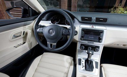 Motor vehicle, Steering part, Steering wheel, Automotive mirror, White, Center console, Car, Personal luxury car, Vehicle audio, Luxury vehicle, 