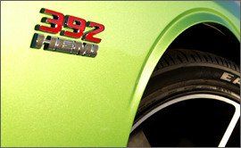 Motor vehicle, Green, Yellow, Photograph, Fender, Logo, Font, Alloy wheel, Photography, Snapshot, 