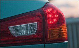 Automotive tail & brake light, Automotive design, Automotive lighting, Automotive parking light, Red, Photograph, Car, Automotive exterior, Amber, Light, 