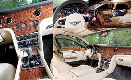 Motor vehicle, Steering part, Steering wheel, Center console, Car, Classic car, Vehicle audio, Personal luxury car, Luxury vehicle, Gauge, 