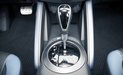 Motor vehicle, Mode of transport, Automotive design, Gear shift, Luxury vehicle, Personal luxury car, Steering part, Steering wheel, Center console, Silver, 