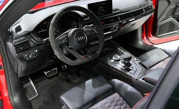 Motor vehicle, Steering part, Mode of transport, Steering wheel, Automotive design, Vehicle audio, Center console, Red, Automotive mirror, Personal luxury car, 