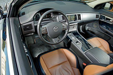 Motor vehicle, Steering part, Mode of transport, Steering wheel, Center console, Vehicle audio, Personal luxury car, Automotive mirror, Vehicle door, Gear shift, 