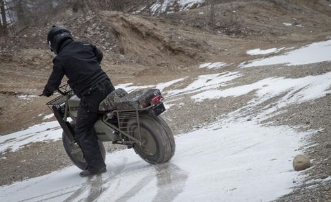 Motorcycle, Automotive tire, Snow, Fender, Motorcycle helmet, Tread, Auto part, Winter, Synthetic rubber, Freezing, 