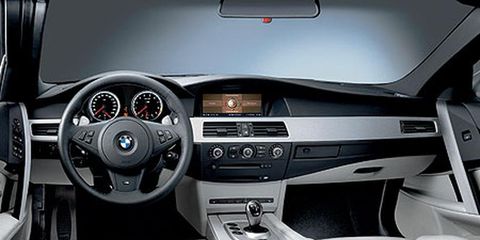 Motor vehicle, Mode of transport, Steering part, Automotive design, Product, Steering wheel, Car, White, Center console, Automotive mirror, 