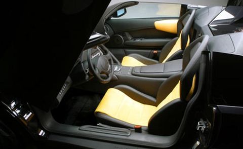 Motor vehicle, Mode of transport, Automotive design, Yellow, Steering part, Steering wheel, Vehicle door, Personal luxury car, Car seat, Luxury vehicle, 