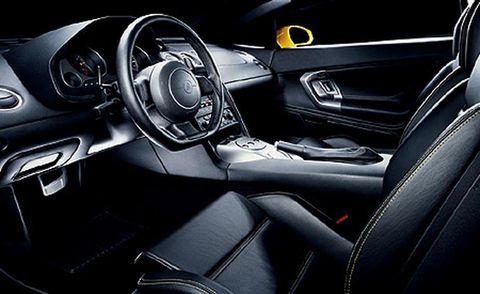 Motor vehicle, Automotive design, Steering part, Steering wheel, Center console, Personal luxury car, Luxury vehicle, Black, Gear shift, Speedometer, 