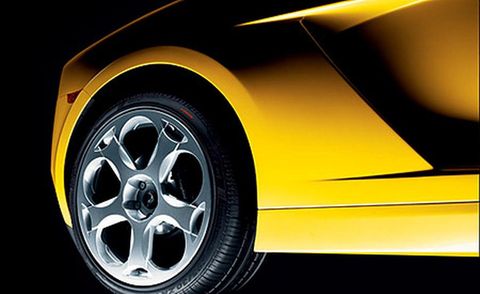 Tire, Wheel, Automotive design, Alloy wheel, Yellow, Automotive exterior, Automotive tire, Vehicle, Rim, Automotive wheel system, 