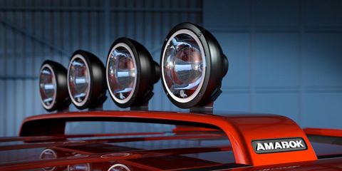 Motor vehicle, Automotive lighting, Automotive exterior, Headlamp, Classic car, Logo, Classic, Automotive light bulb, Symbol, Kit car, 