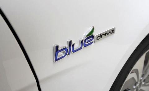 Motor vehicle, Automotive design, Text, Automotive exterior, Logo, Symbol, Electric blue, Brand, Trademark, Emblem, 