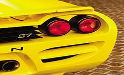Yellow, Red, Automotive lighting, Amber, Supercar, Orange, Sports car, Bumper, Design, Automotive tail & brake light, 