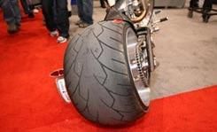 Automotive tire, Mode of transport, Automotive design, Red, Floor, Rim, Automotive wheel system, Flooring, Auto part, Fender, 