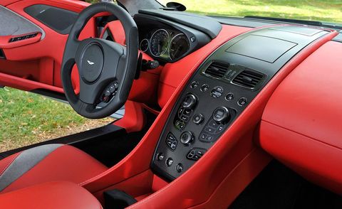 Motor vehicle, Steering part, Mode of transport, Steering wheel, Automotive design, Vehicle, Transport, Automotive mirror, Center console, Red, 