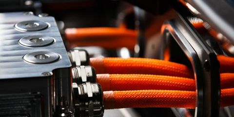Orange, Cable, Technology, Machine, Wire, Electrical wiring, Steel, Still life photography, Electrical connector, Hose, 