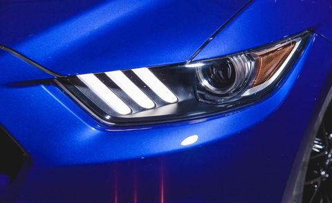 Blue, Automotive design, Daytime, Hood, Automotive lighting, Automotive exterior, Headlamp, Grille, Electric blue, Car, 