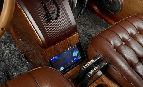Electronic device, Center console, Steering part, Tan, Leather, Luxury vehicle, Radio, Steering wheel, Vehicle audio, Multimedia, 