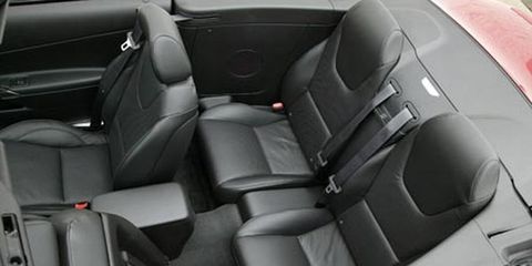 Motor vehicle, Car seat, Vehicle door, Car seat cover, Seat belt, Luxury vehicle, Head restraint, Silver, Personal luxury car, Leather, 