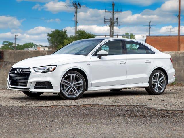 2017 audi a3 parked near a short cement wall