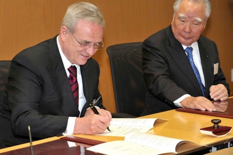 Martin Winterkorn, chairman of the board of management of Volkswagen AG, and Osamu Suzuki, CEO Suzuki