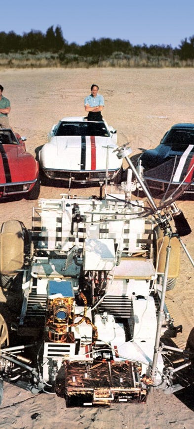 jim irwin, al worden, and dave scott pose with their corvettes and a lunar rover