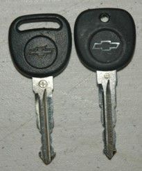 Ignition key with slot versus hole