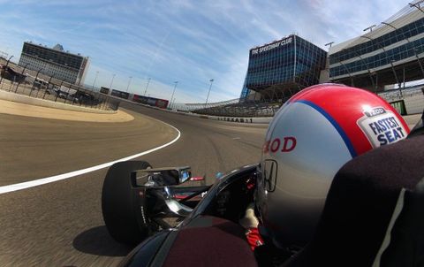 Mario Andretti piloting two-seat IndyCar