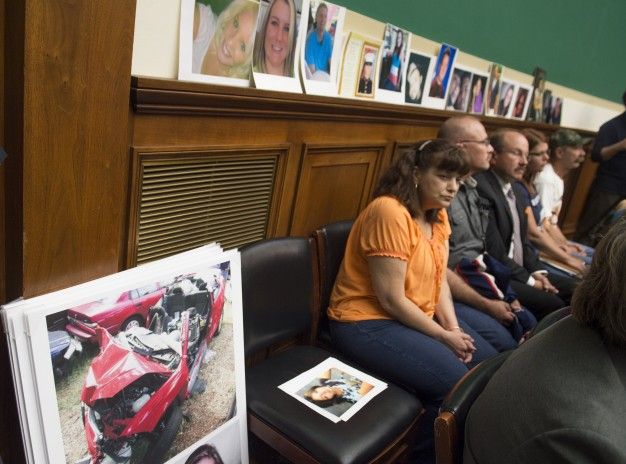Family members of victims affected by GM's faulty ignition switch listen at a U.S. House hearing in June.